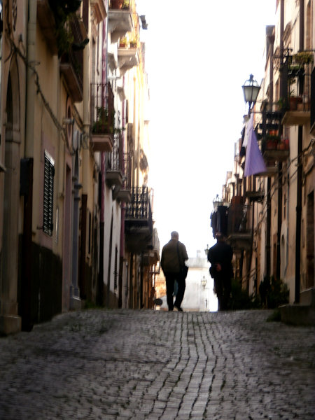 Ferrandina - City of vultures & brigands - Strolling towards the sun in a cool dim street